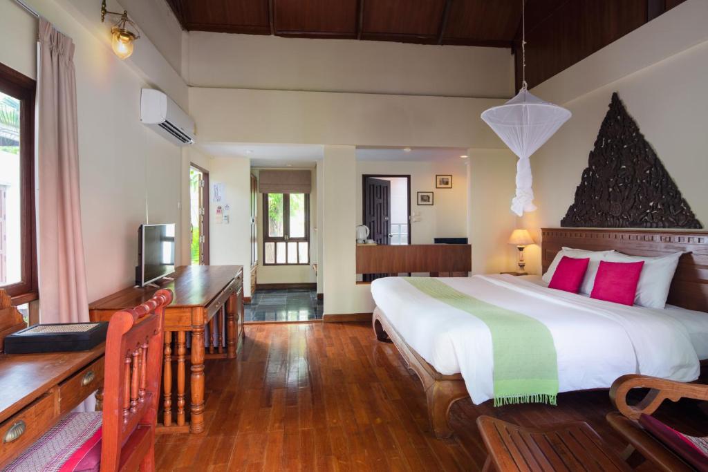 a bedroom with a large bed in a room at Royal Lanta Resort & Spa in Ko Lanta