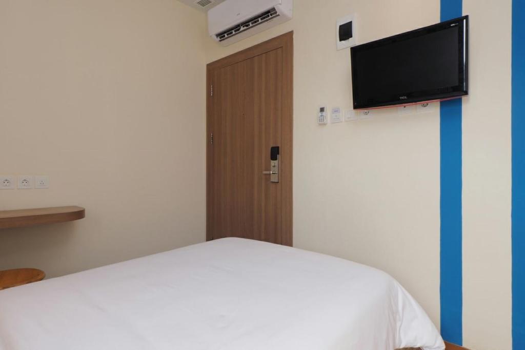 TV a/nebo společenská místnost v ubytování Kama Hotel