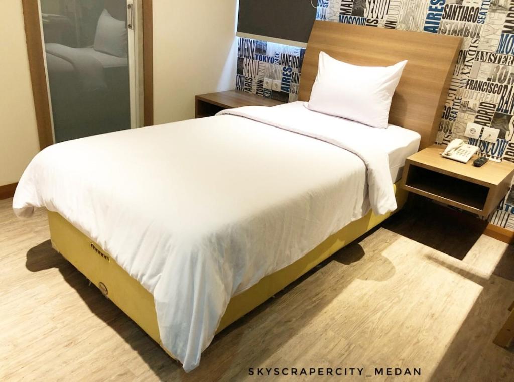 Postel nebo postele na pokoji v ubytování Kama Hotel