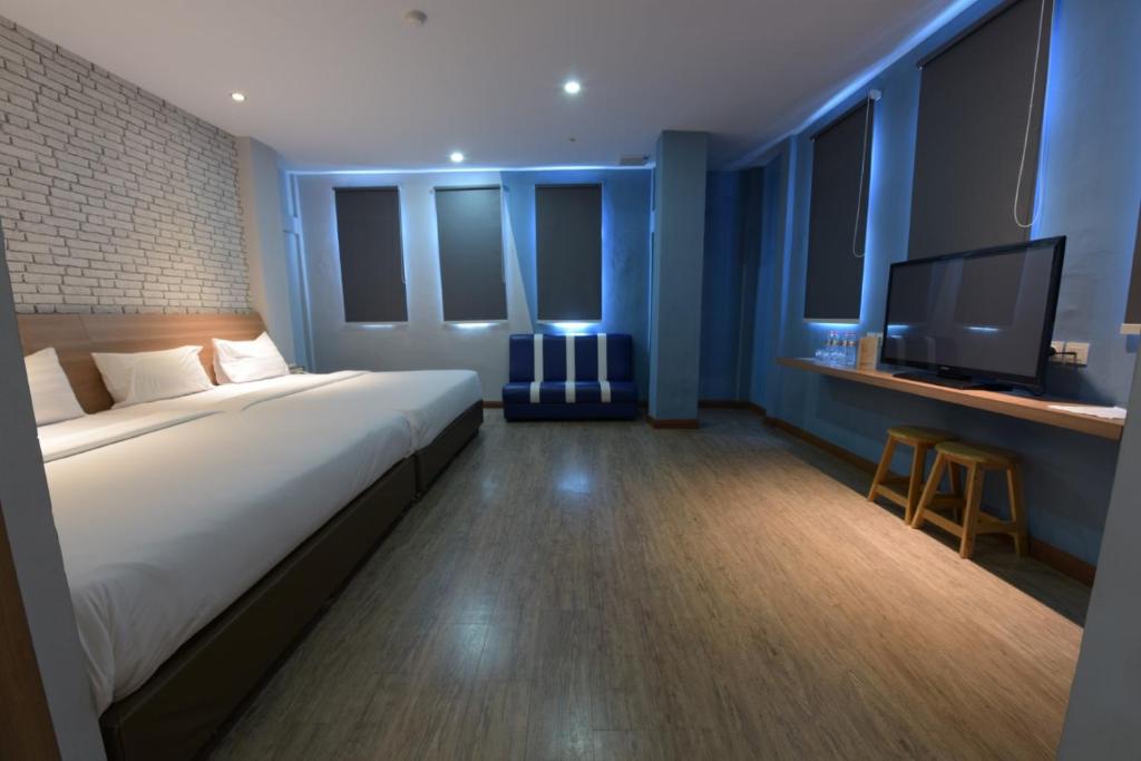 Postel nebo postele na pokoji v ubytování Kama Hotel