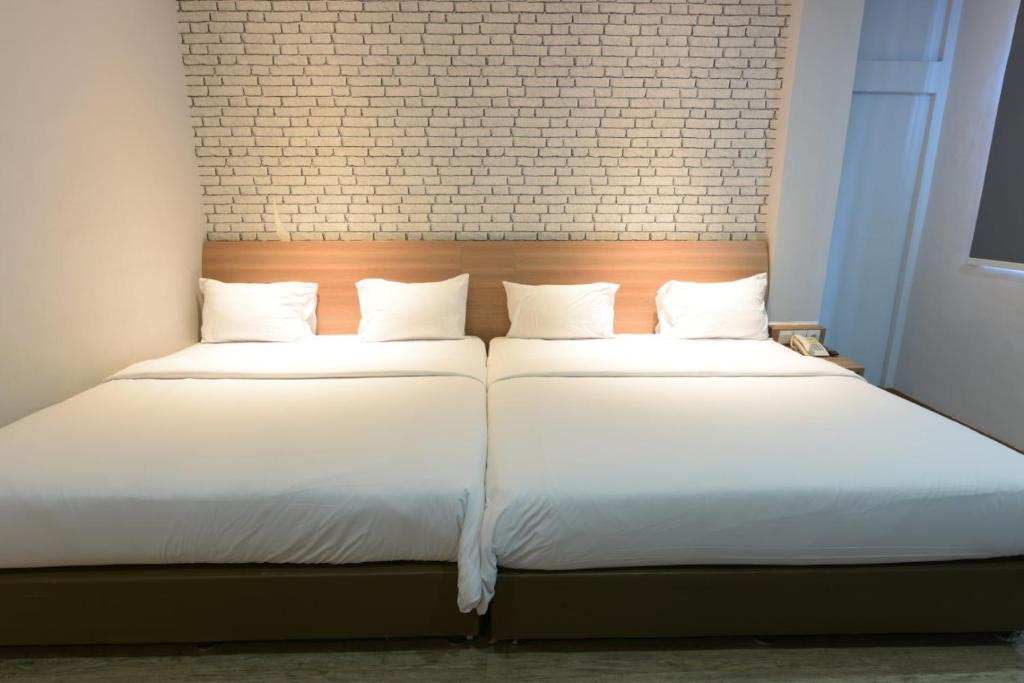 Postel nebo postele na pokoji v ubytování Kama Hotel