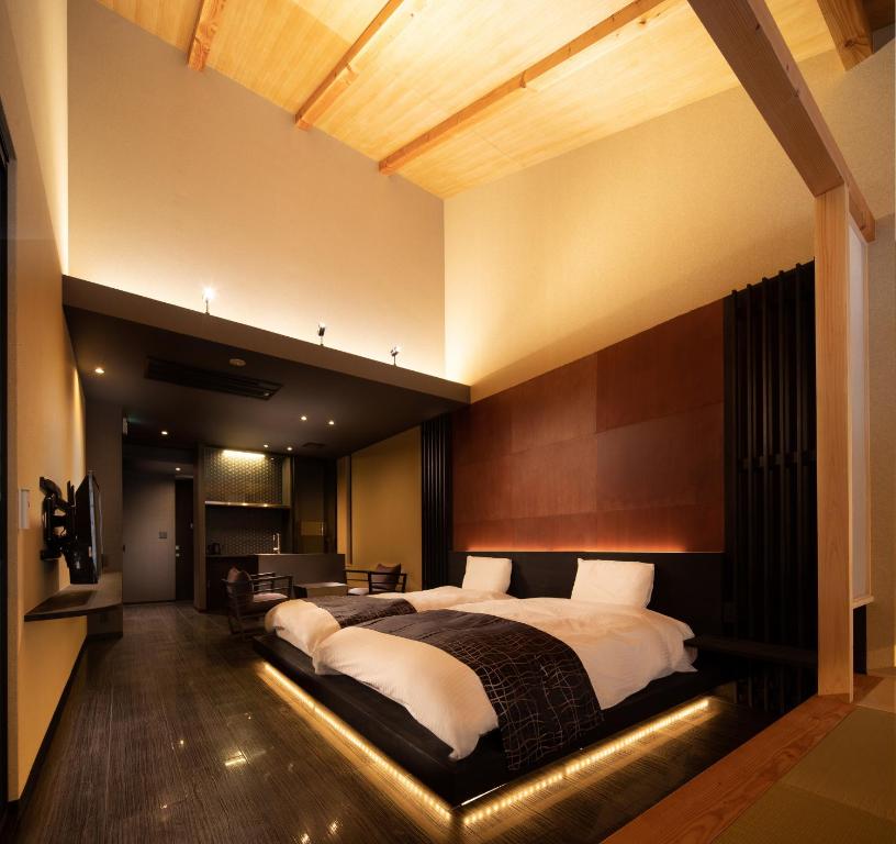 Cama ou camas em um quarto em Tsumugi Tojihigashimonmae