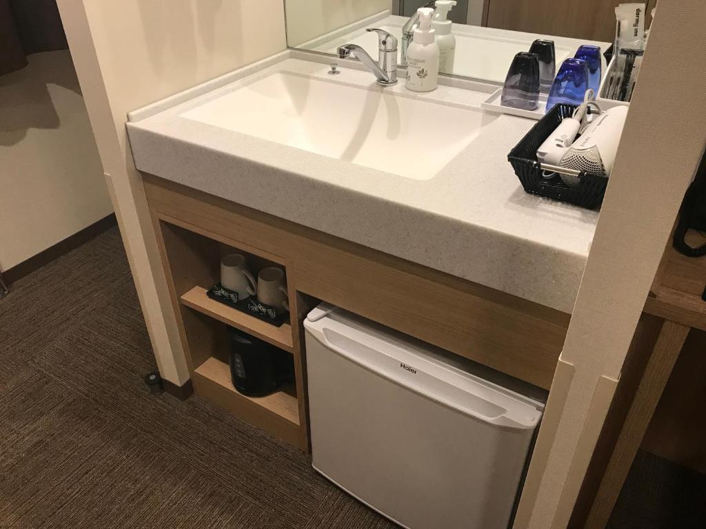 Kuchyň nebo kuchyňský kout v ubytování Dormy Inn Mito