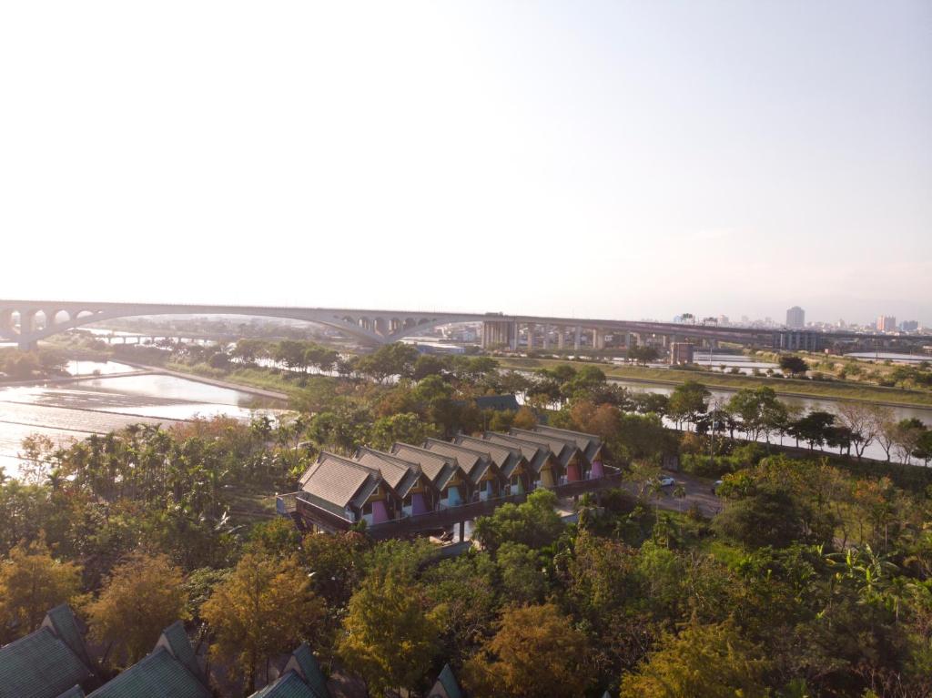 an aerial view of a building next to a river at Kitefarm in Dongshan