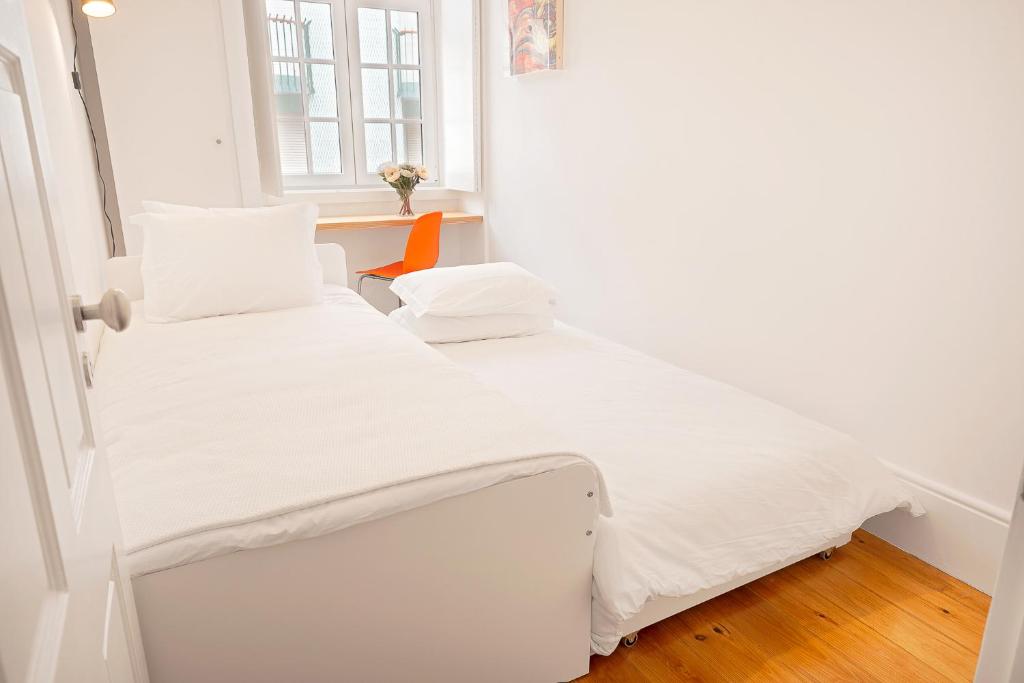 Postel nebo postele na pokoji v ubytování Oporto Classic Pàtio