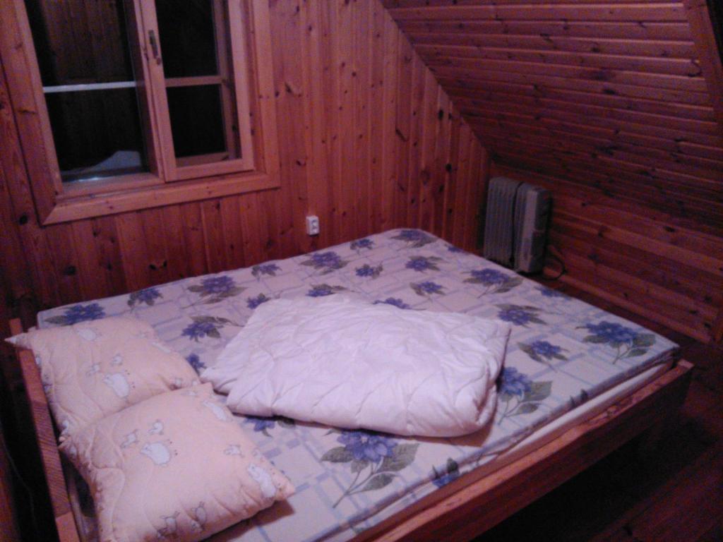 Postel nebo postele na pokoji v ubytování Hundi Holiday House