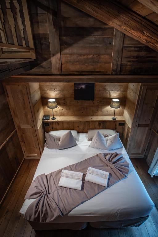 Postel nebo postele na pokoji v ubytování Chalet Svizzero