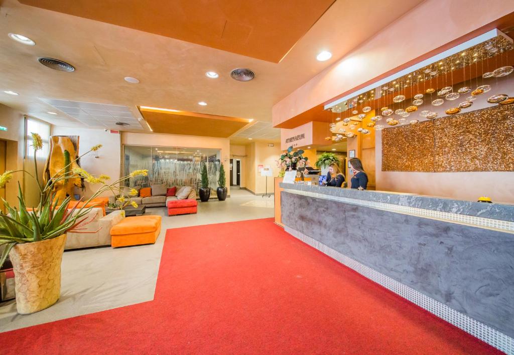 a lobby of a hotel with a red carpet at Albergo Athenaeum in Palermo