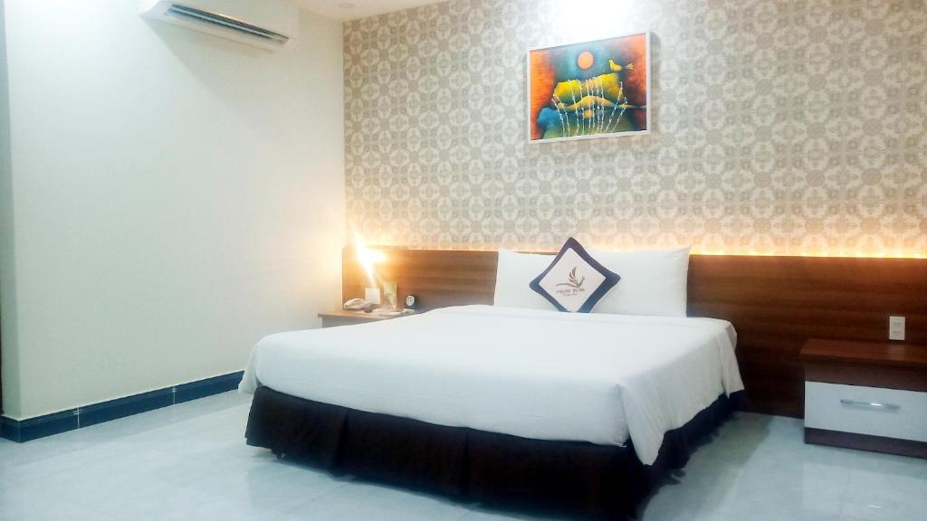 Phung Hung Boutique Hotelにあるベッド
