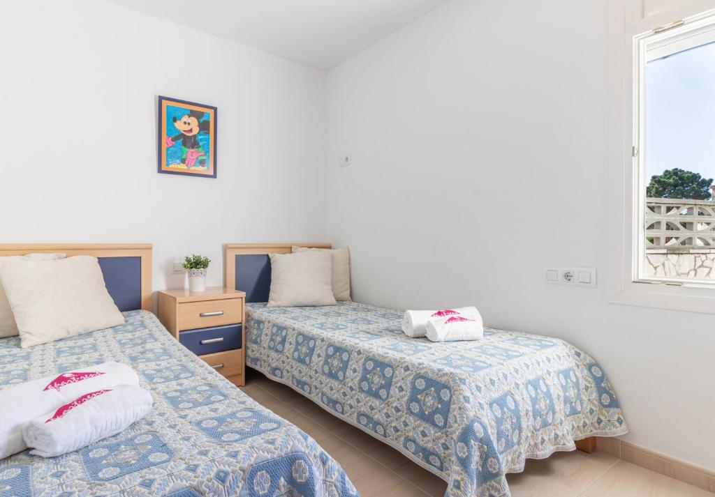 A bed or beds in a room at Apart-rent Casa Grecs 2029