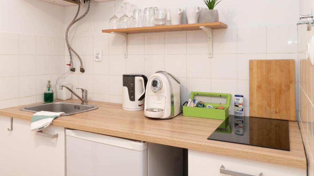 Kuchyň nebo kuchyňský kout v ubytování Cocorico Apartments