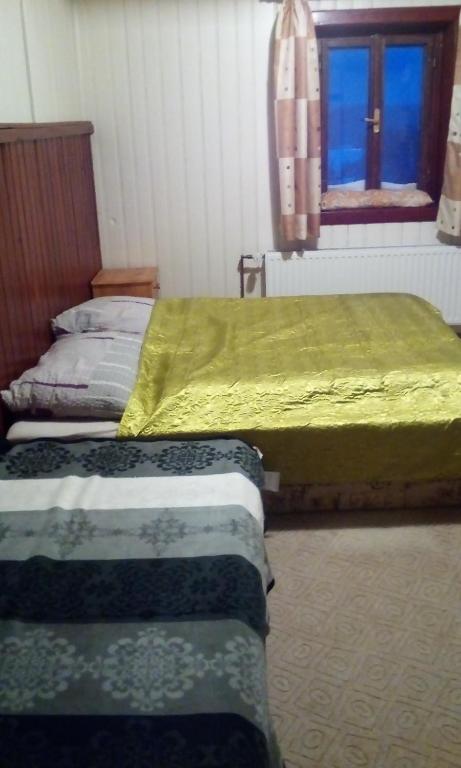 Postel nebo postele na pokoji v ubytování Guest House Leona