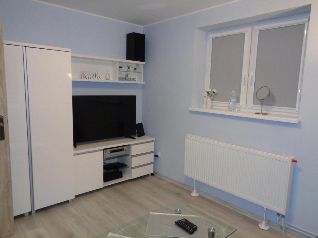 Televízia a/alebo spoločenská miestnosť v ubytovaní Apartament Szczawno-Zdrój -Wałbrzych