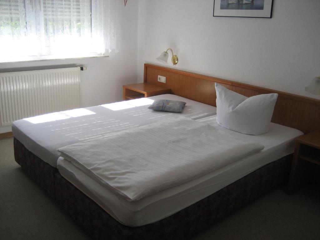 Postel nebo postele na pokoji v ubytování Hotel Kirchner