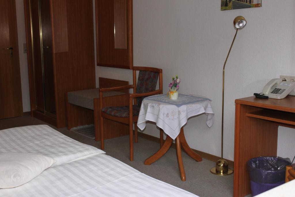 Postel nebo postele na pokoji v ubytování Hotel Kirchner