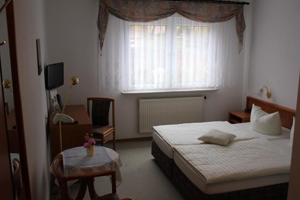 Postel nebo postele na pokoji v ubytování Hotel Kirchner