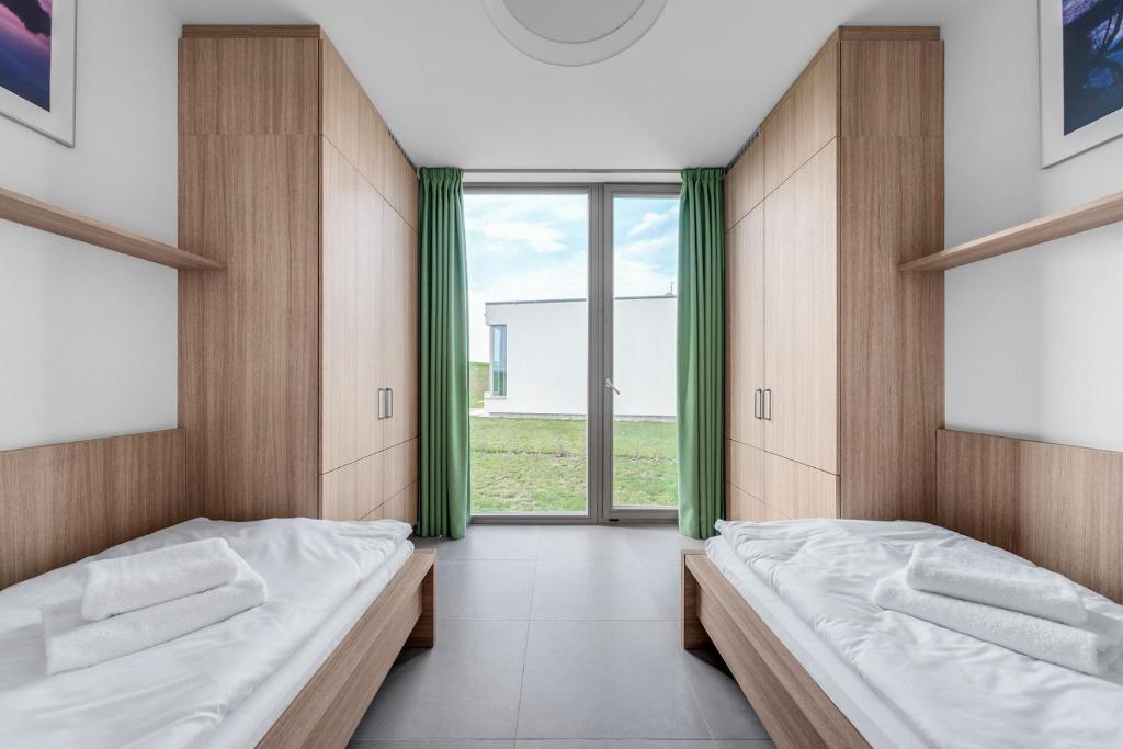Postel nebo postele na pokoji v ubytování Apartmány HRÁDEČEK