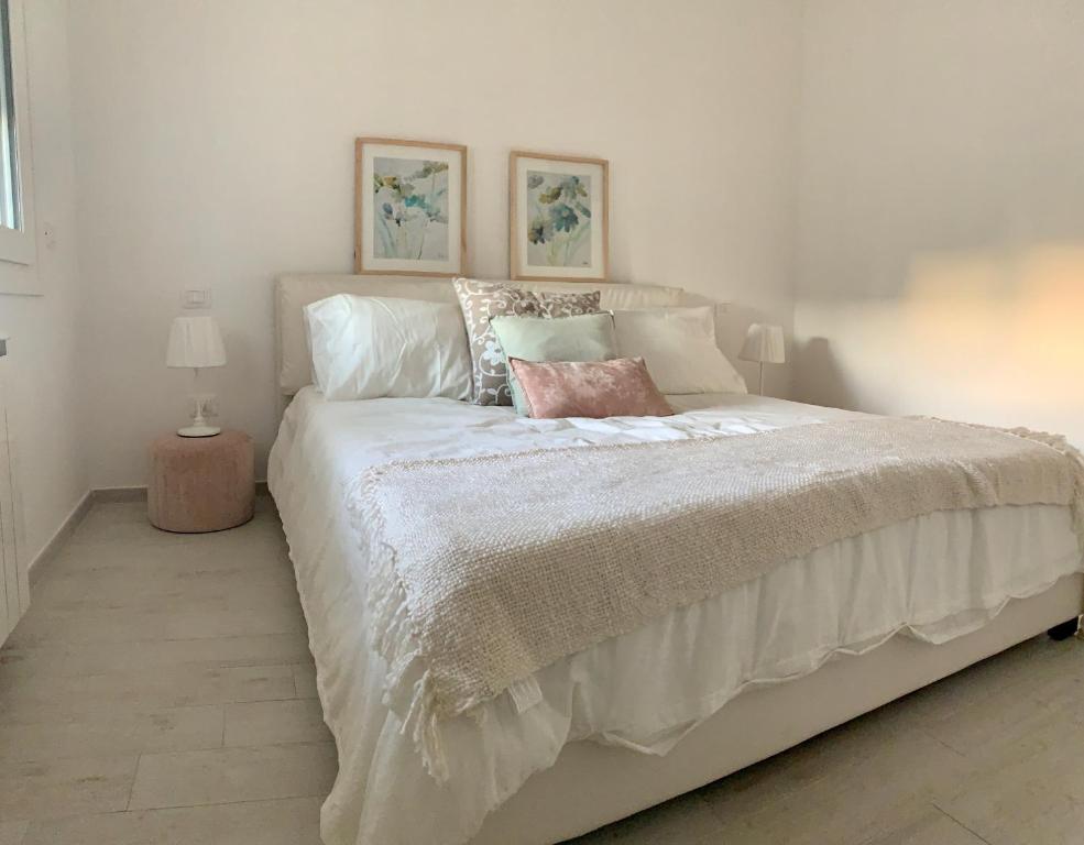 Postel nebo postele na pokoji v ubytování Puro Lino Tropea "Luxury Stay"