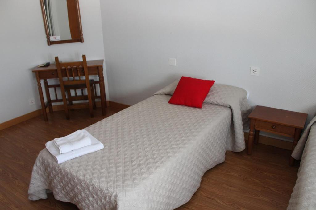 Postel nebo postele na pokoji v ubytování HOSTAL ALTO PÁRAMO