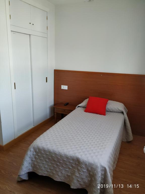 Postel nebo postele na pokoji v ubytování HOSTAL ALTO PÁRAMO