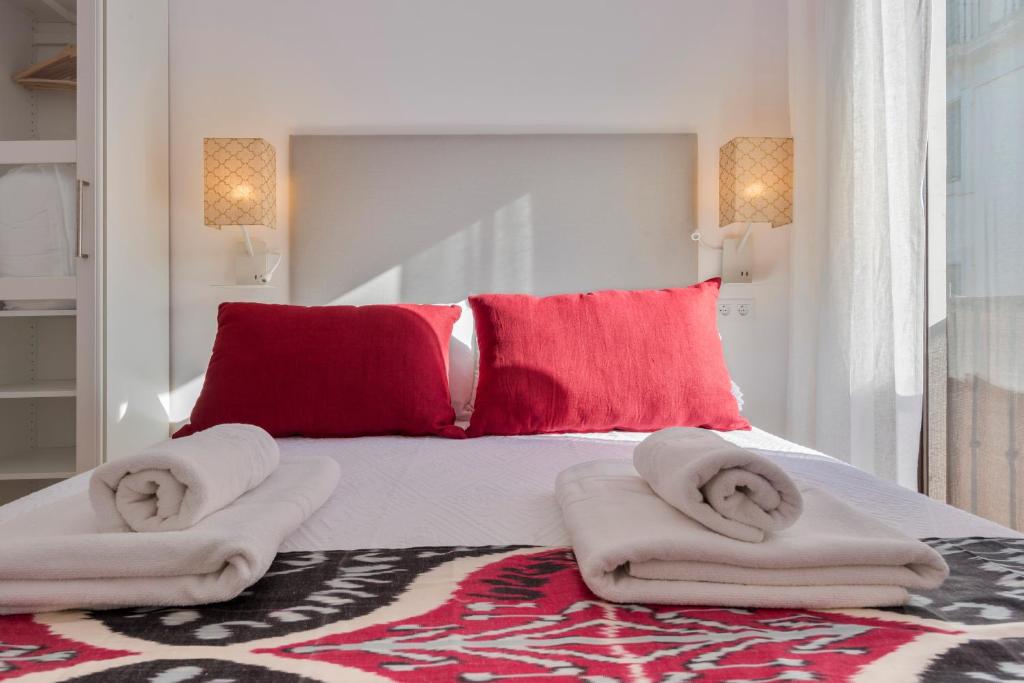 A bed or beds in a room at Genteel Home Cabildo