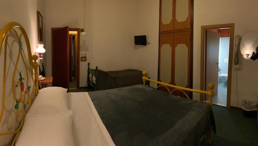 Posteľ alebo postele v izbe v ubytovaní Hotel Ficocle