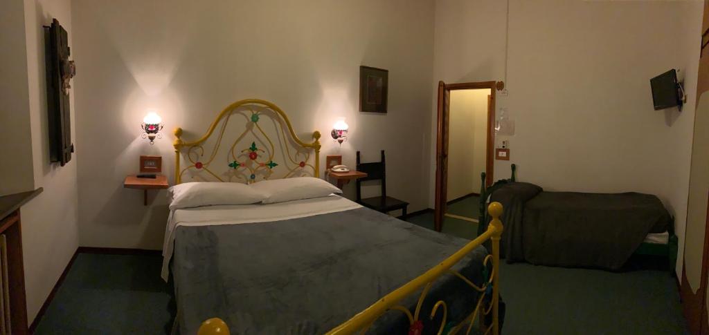 Posteľ alebo postele v izbe v ubytovaní Hotel Ficocle