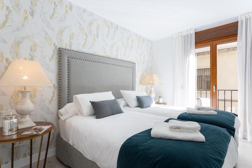 A bed or beds in a room at Genteel Home Cabildo