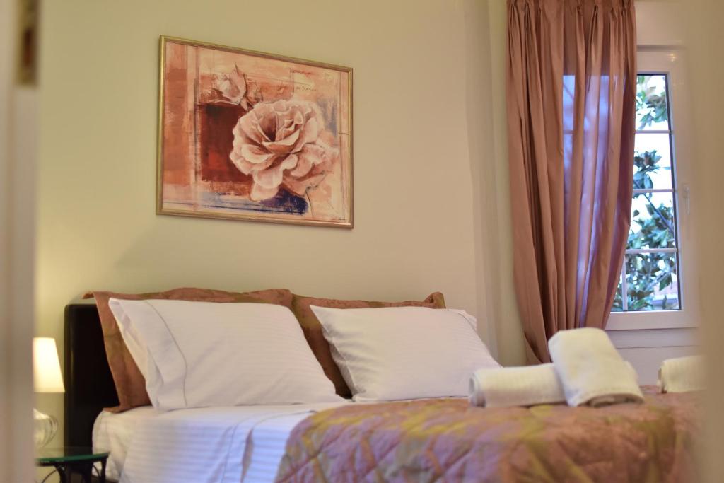 Ένα ή περισσότερα κρεβάτια σε δωμάτιο στο Magnolia House in Ioannina