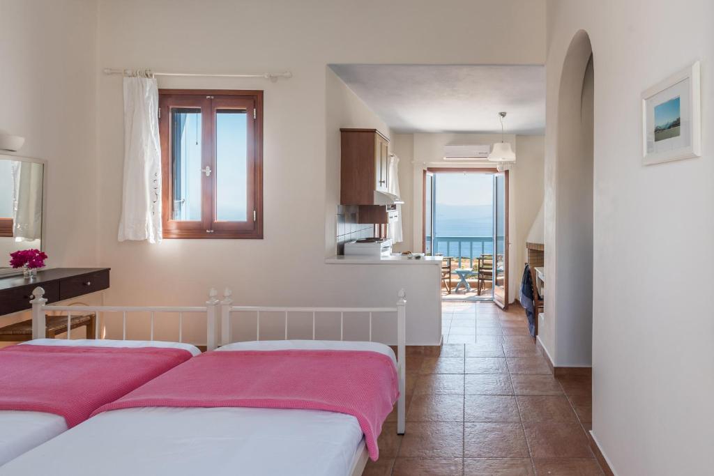 Postel nebo postele na pokoji v ubytování Asterias House