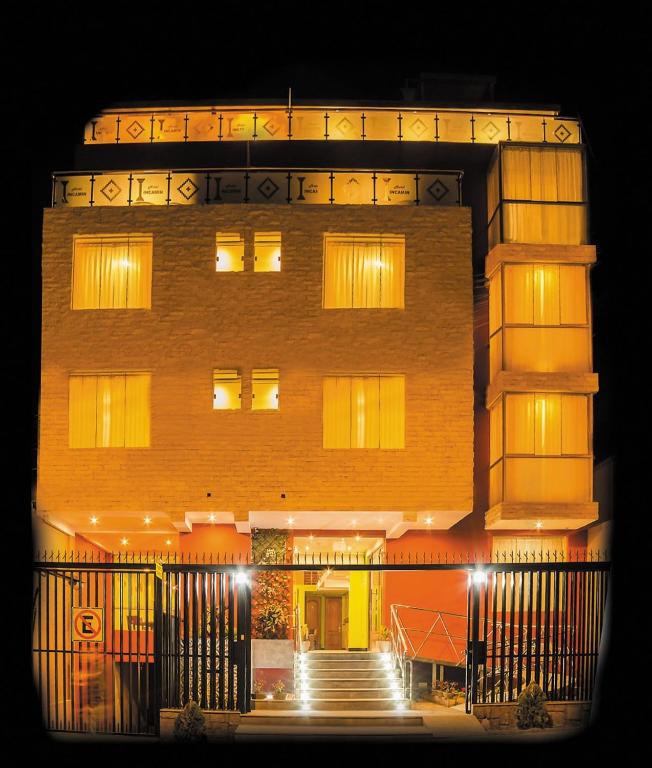 a tall brick building with stairs in front of it at Hotel Incamin Mirador in Arequipa