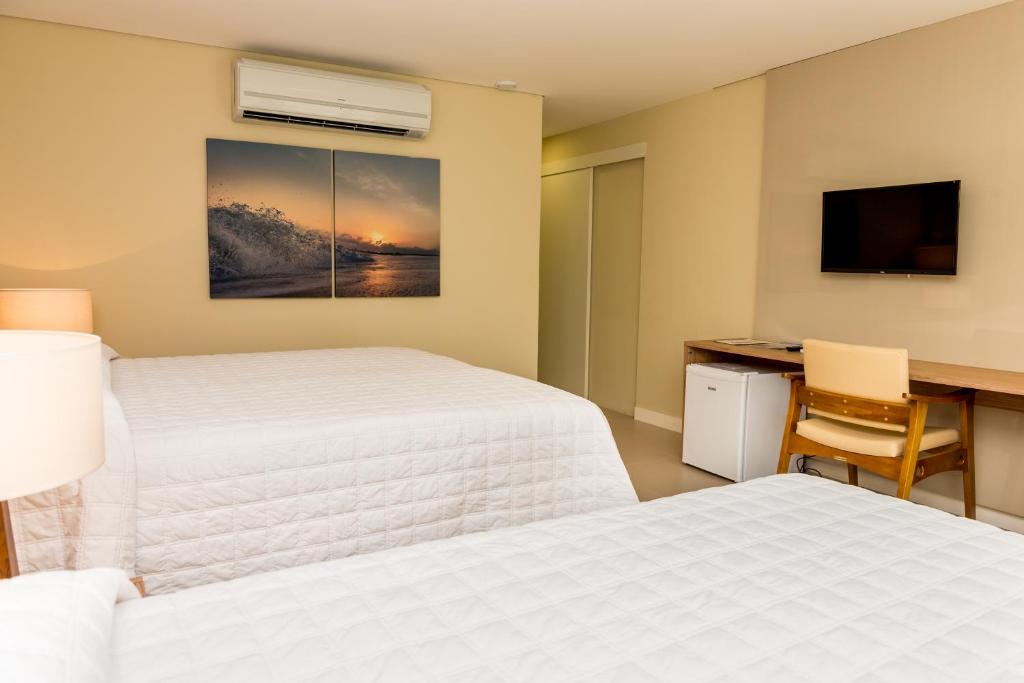Cama ou camas em um quarto em Hotel Senac Barreira Roxa