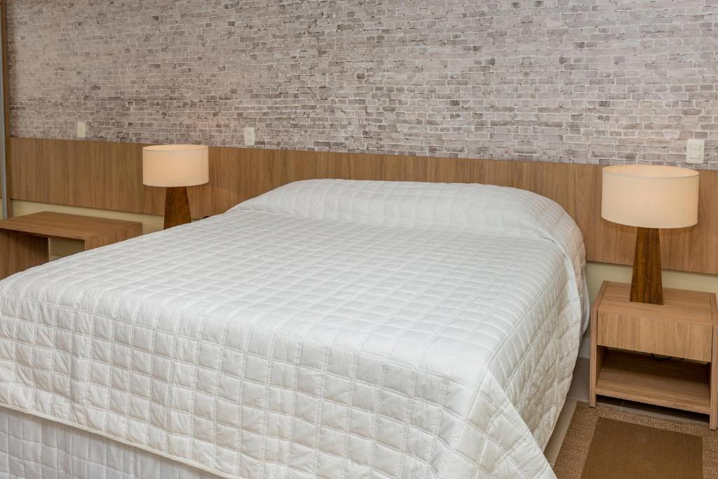 Cama ou camas em um quarto em Hotel Senac Barreira Roxa