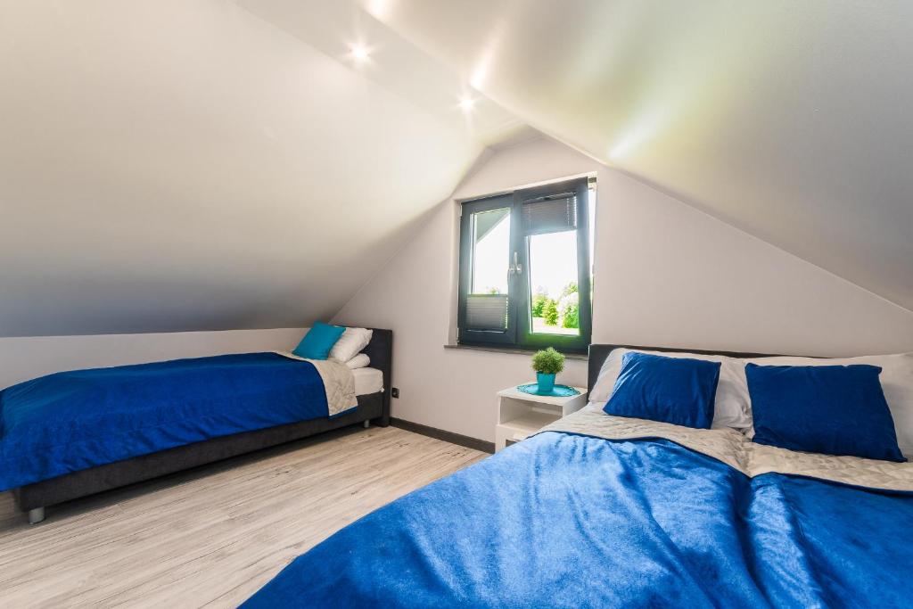 Postel nebo postele na pokoji v ubytování Hygge Domki