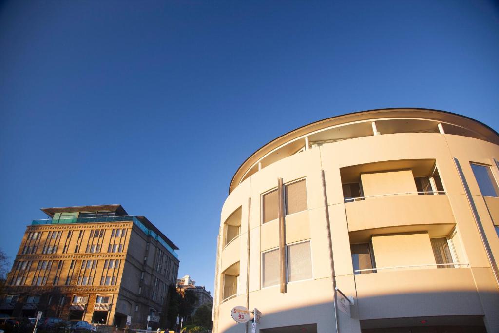 a building with a dome on the side of it at Salamanca Terraces in Hobart