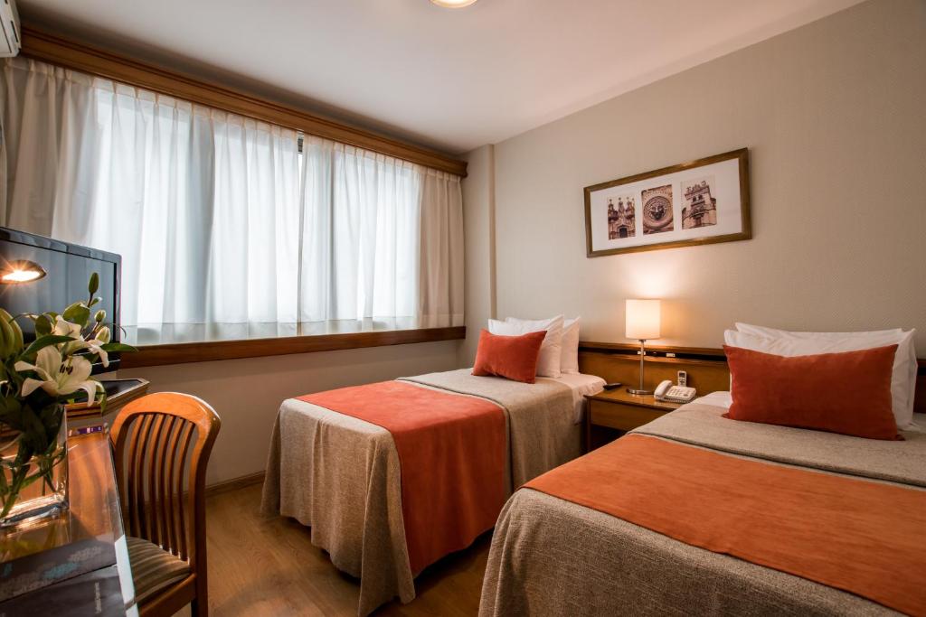 מיטה או מיטות בחדר ב-Hotel Solans Carlton