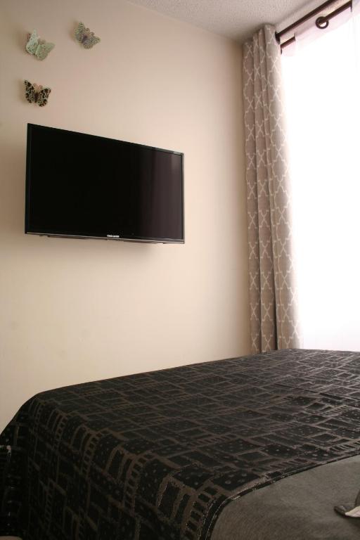 TV a/nebo společenská místnost v ubytování AlohaT Habitaciones