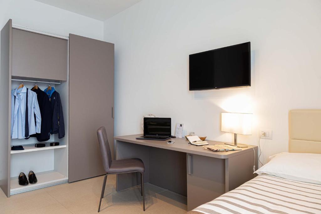 TV a/nebo společenská místnost v ubytování Moma Hotel Wellness & Spa