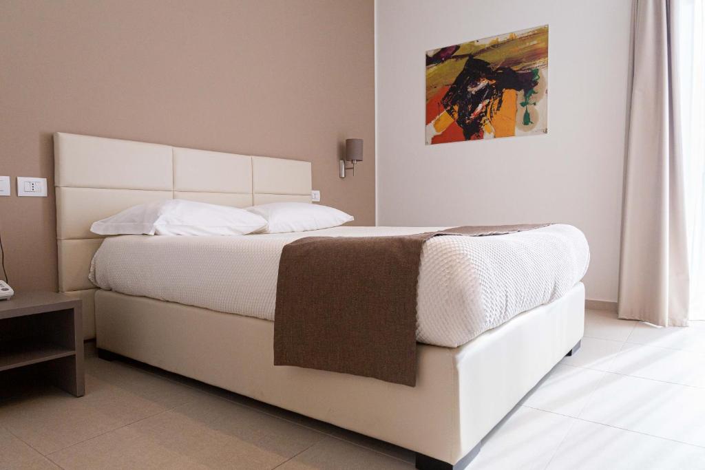 Postel nebo postele na pokoji v ubytování Moma Hotel Wellness & Spa