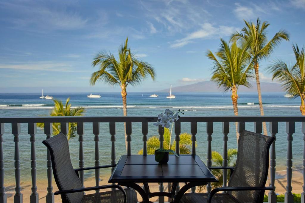 a beach scene with a view of the ocean at Lahaina Shores Beach Resort, a Destination by Hyatt Residence in Lahaina