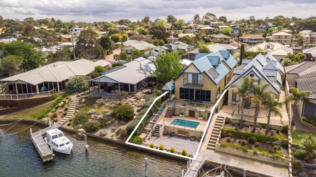 an aerial view of a house on the water at The Loft in Paynesville