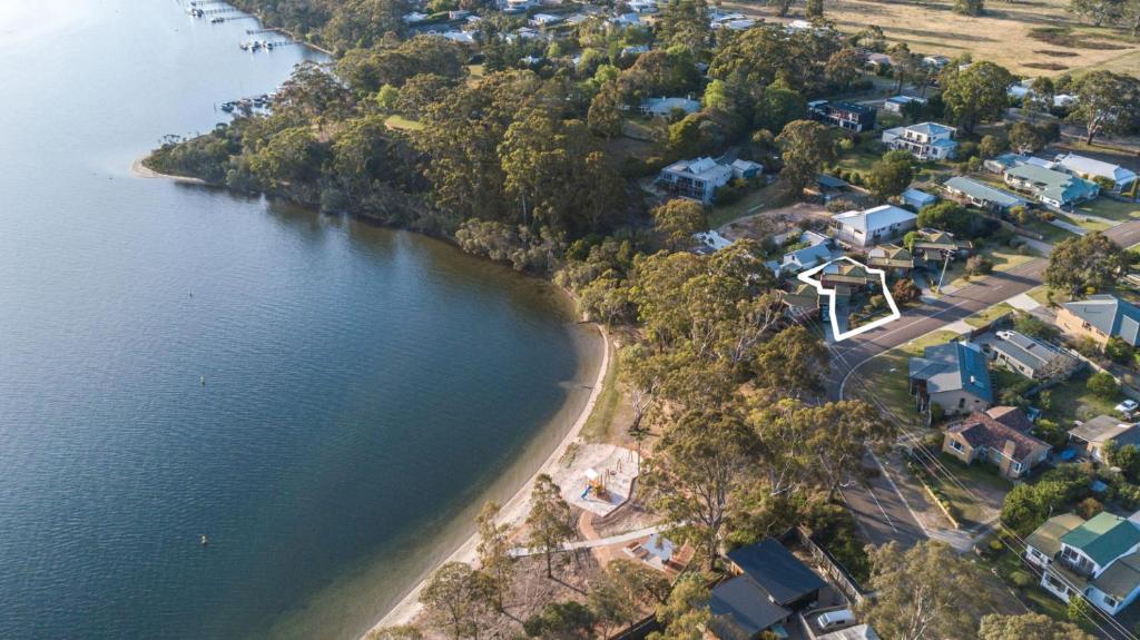 an aerial view of the shore of a lake at Above Sunset in Paynesville