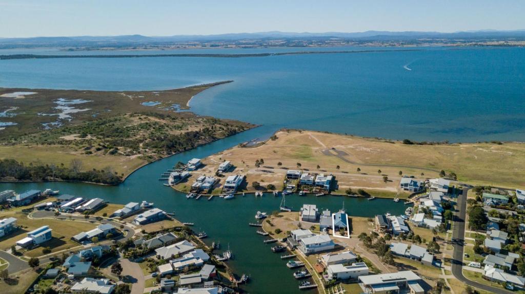 an aerial view of a harbor with houses and the water at Pelican Landing in Paynesville