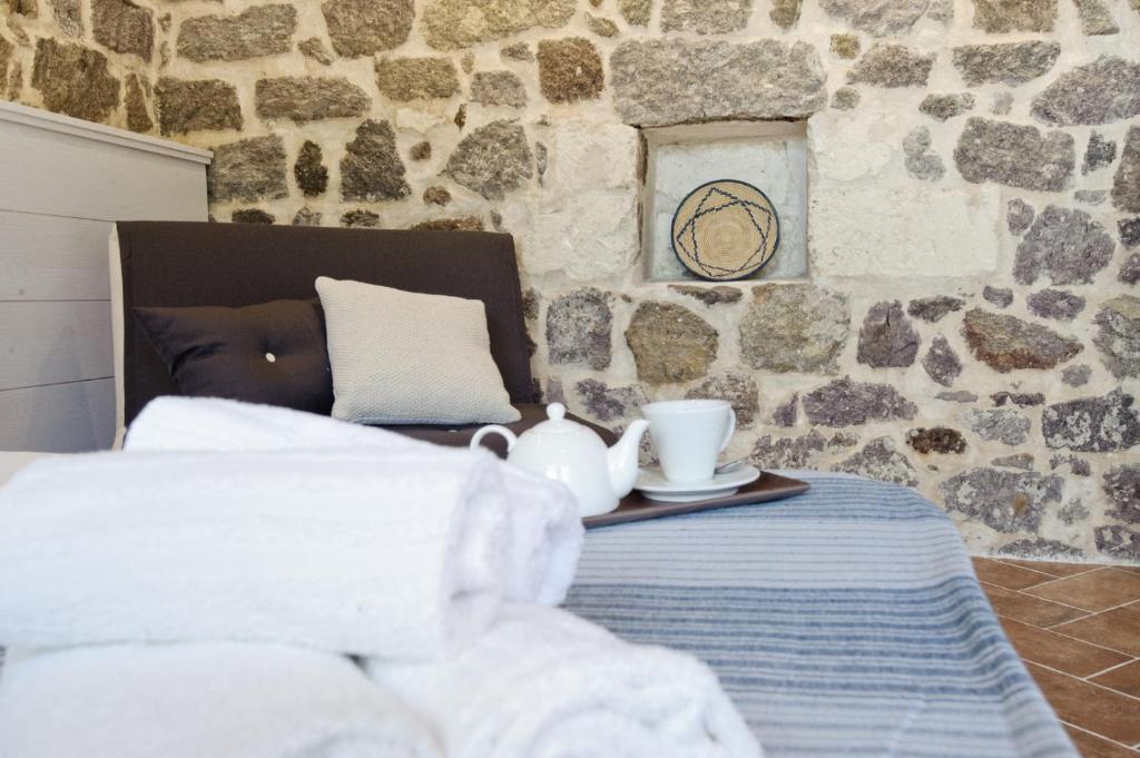 Postel nebo postele na pokoji v ubytování B&B La Roccia