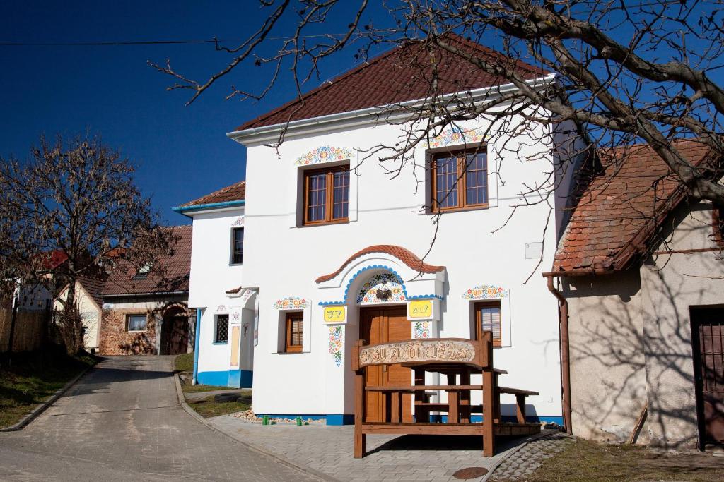 a white building with a sign in front of it at San Marco - Vinný sklep in Mutěnice