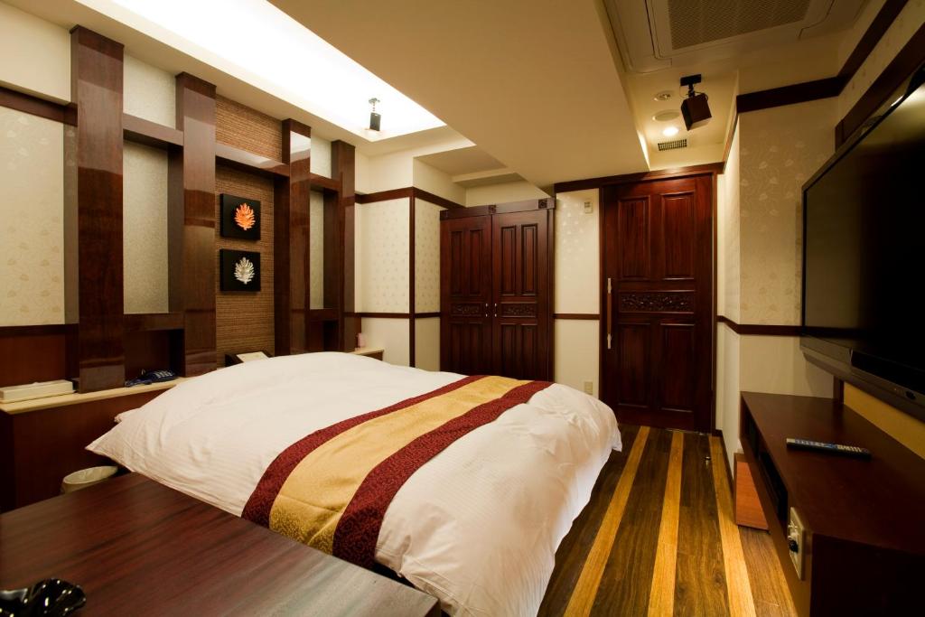 Postel nebo postele na pokoji v ubytování Hotel Bintang Pari Resort (Adult Only)