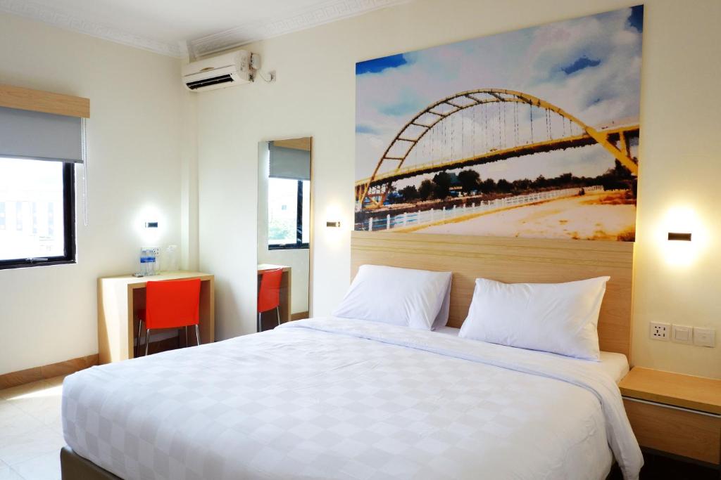 Posteľ alebo postele v izbe v ubytovaní Cordex Oase Pekanbaru