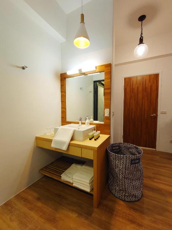 Postel nebo postele na pokoji v ubytování 高寮貳陸之貳民宿 Gaoliao 26-2 Simple Home Life