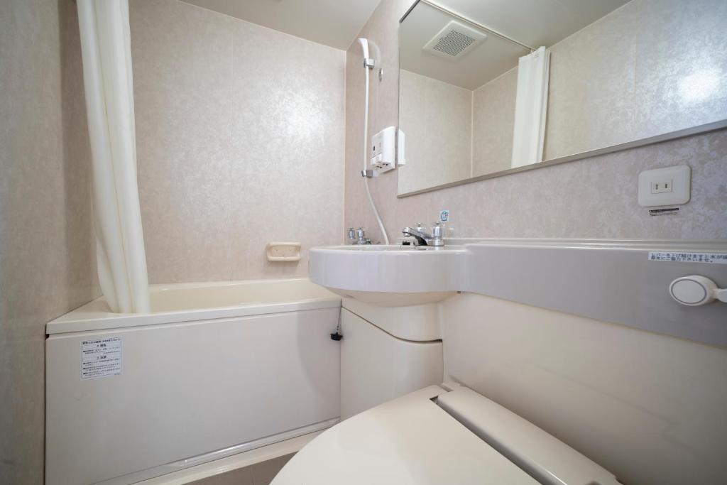 Koupelna v ubytování Hotel Econo Taki