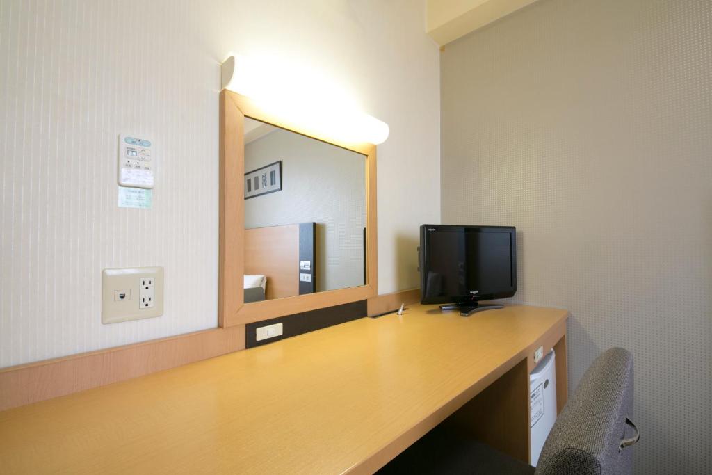 TV a/nebo společenská místnost v ubytování Hotel Econo Taki
